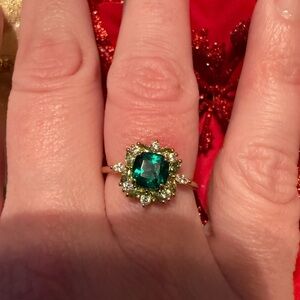 Green faux emerald ring.
